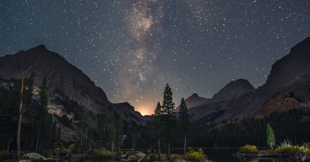 Captivating Milky Way reflection over a serene mountain lake, perfect night photography