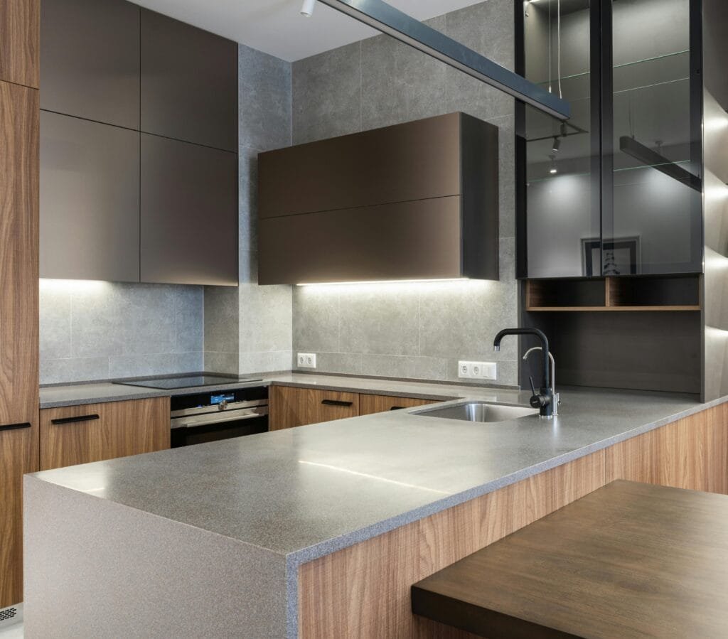 pexels-photo-6489127-6489127 Sleek and modern kitchen with contemporary appliances and wooden cabinetry.