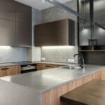 Sleek and modern kitchen with contemporary appliances and wooden cabinetry.