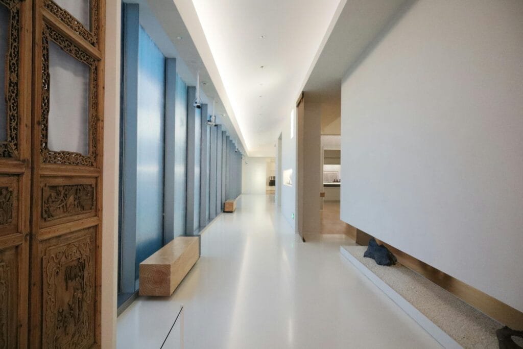 pexels-photo-34579057-34579057 Sleek modern hallway with wooden accents and minimalist architecture.